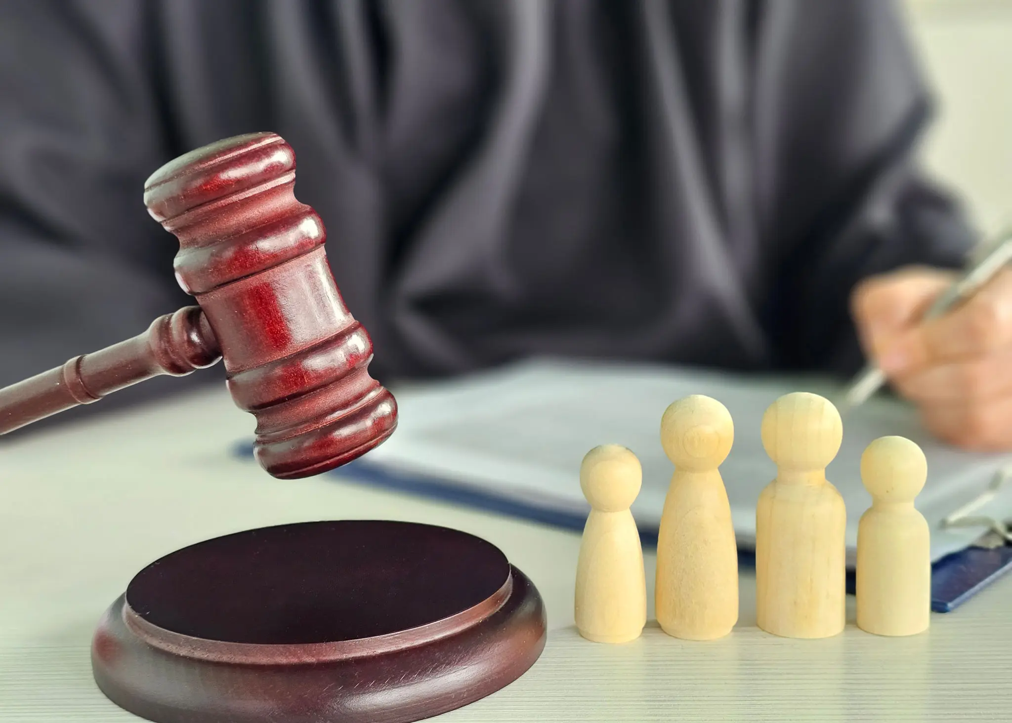Gavel and wooden figures on a table